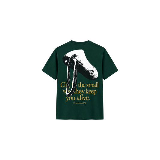 Green t-shirt with graphic design and text on a white background